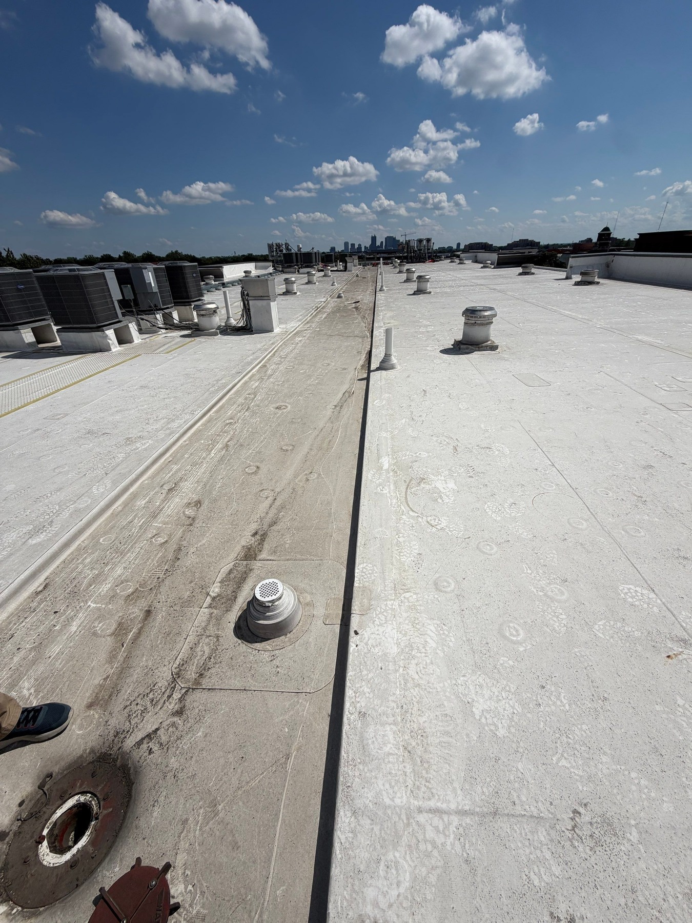The drain and surrounding TPO membrane at the apartment building.